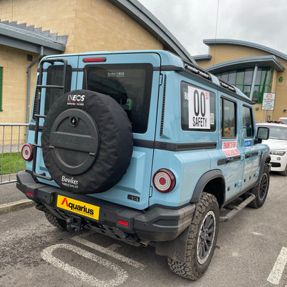 baby blue ineos grenadier with aquarius canvas wheel cover on